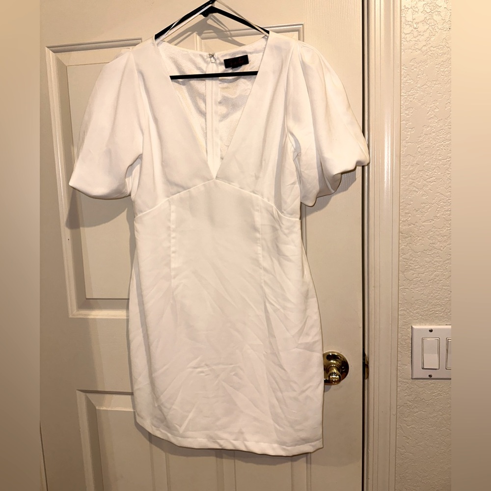 White mini, plunging neckline dress